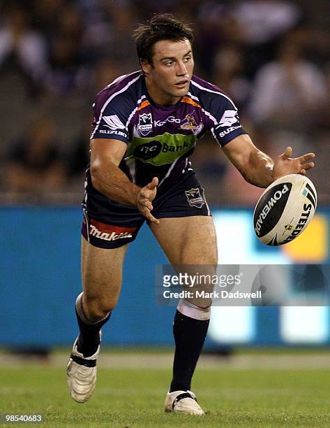 Cooper Cronk of the Storm throws a pass during the round six NRL match between the Melbourne Storm and the Manly Sea Eagles at Etihad Stadium on...