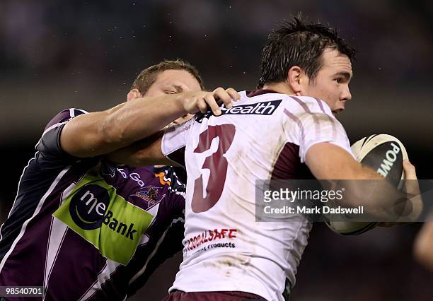 Jamie Lyon of the Sea Eagles is tackled by Ryan Hoffman of the Storm during the round six NRL match between the Melbourne Storm and the Manly Sea...