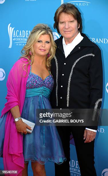 Musician John Fogerty arrives with his wife Julie Lebiedzinski for the 45th Academy of Country Music Awards in Las Vegas, Nevada, on April 18, 2010....