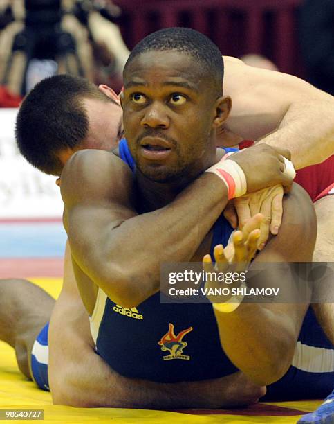 French Melonin Noumonvi competes for the bronze with Croatian Nenad Zugaj during men's Free Style Wrestling 84 kg event at the Senior Wrestling...