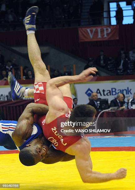 French Melonin Noumonvi competes for the bronze with Croatian Nenad Zugaj during men's Free Style Wrestling 84 kg event at the Senior Wrestling...