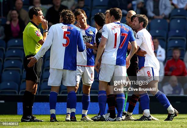 Morten Gamst Pedersen of Blackburn Rovers touches his eye after being poked in it by Mikel Arteta of Everton during the Barclays Premier League match...