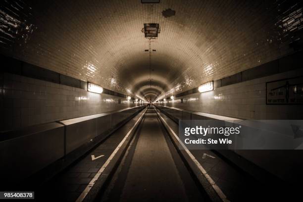 the long way  // alter elbtunnel - elbtunnel stock pictures, royalty-free photos & images