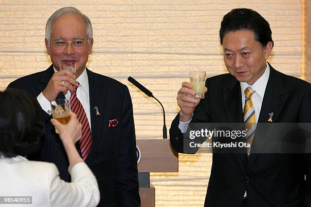 Malaysian Prime Minister Najab Razak and Japanese Prime Minister Yukio Hatoyama raise a toast during a welcome dinner hosted by Hatoyama at...