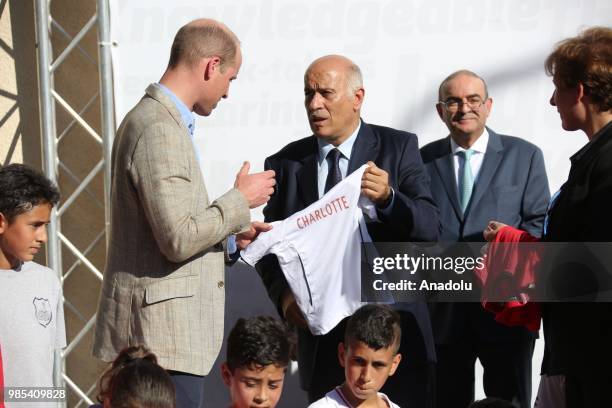 Duke of Cambridge Prince William receives a present from President of Palestinian Football Federation and the Palestine Olympic Committee Jibril...