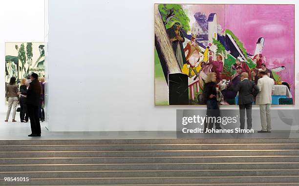 Preview visitors attend the Neo Rauch exhibition 'Begleiter' at Pinakothek der Moderne art museum on April 19, 2010 in Munich, Germany. Due to his...