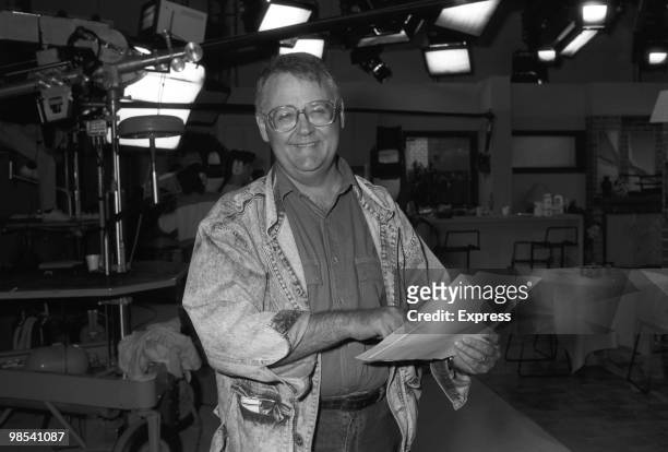 Ian Smith, actor, as Harold Bishop in Australian soap opera Neighbours smiling while holding a script. Australia, 20th October 1988.