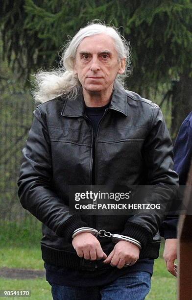 Former militant of the French far-left group Action Directe, Georges Cipriani arrives while wearing handcuffs at the open prison in...