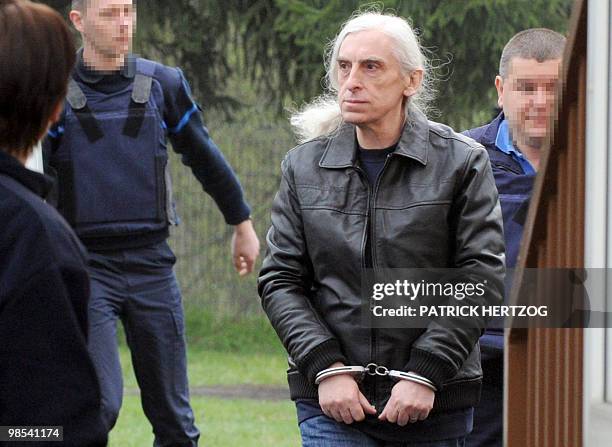 Former militant of the French far-left group Action Directe, Georges Cipriani arrives while wearing handcuffs at the open prison in...