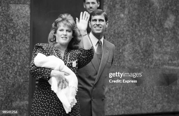 Sarah, Duchess of York, and Prince Andrew, Duke of York, wave to the press as they leave Portland Hospital, London, with their baby daughter Princess...