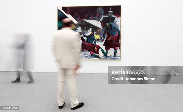 Preview visitors attend the Neo Rauch exhibition 'Begleiter' at Pinakothek der Moderne art museum on April 19, 2010 in Munich, Germany. Due to his...