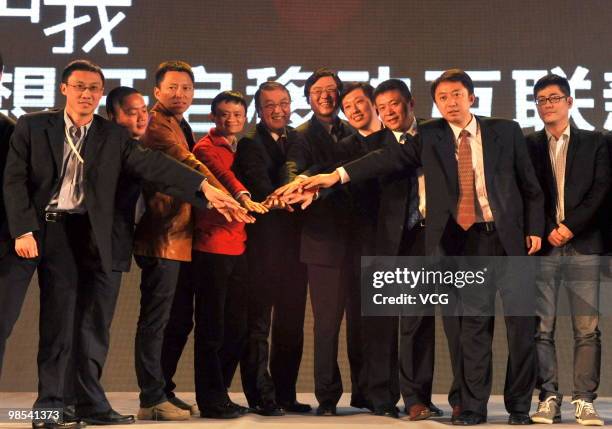Lenovo Group's chairman Liu Chuanzhi, CEO of Chinese computer giant Lenovo Yang Yuanqing, Ma Yun, chairman of Alibaba Group attend the launching...