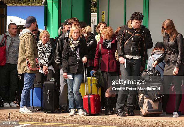 Newly arrived tourists wait for buses at Dover ferry terminal on April 19, 2010 in England. Thousands of UK passengers are unable to return home...