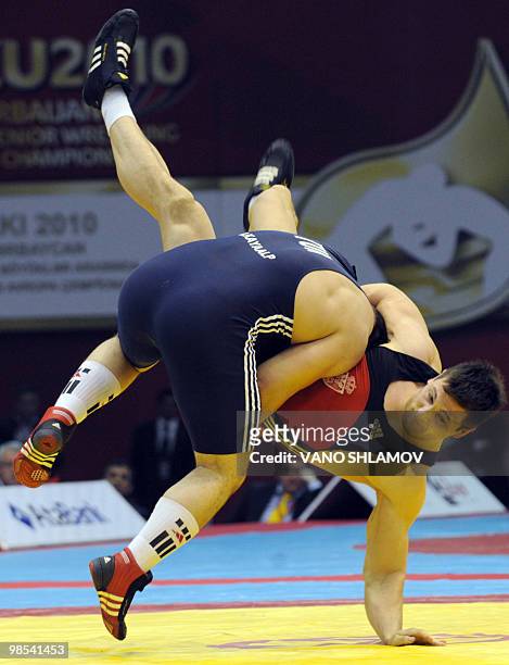 Turkish Riza Kayaalp competes fro the gold medal with Serbian Radomir Petkovic during men's Free Style Wrestling 120 kg event at the Senior Wrestling...