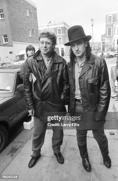 Adam Clayton and Bono of U2 pictured outside SARM Studios in Notting Hill, London, during the recording of the Band Aid single 'Do They Know It's...