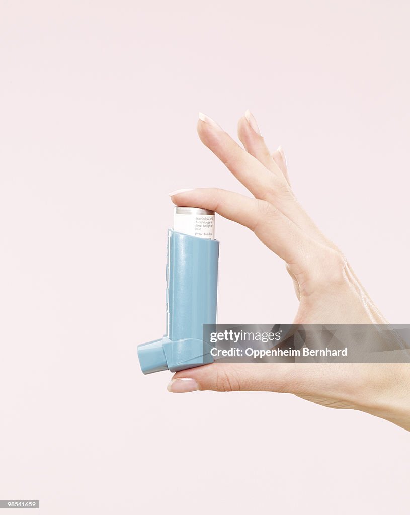 Someone Using Blue Inhaler Female Hand Holding Blue Inhaler High-Res Stock Photo - Getty Images