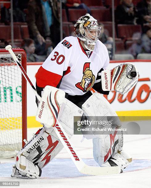 Brian Elliott of the Ottawa Senators makes a glove save during the warm up period prior to facing the Montreal Canadiens in the NHL game on March 22,...