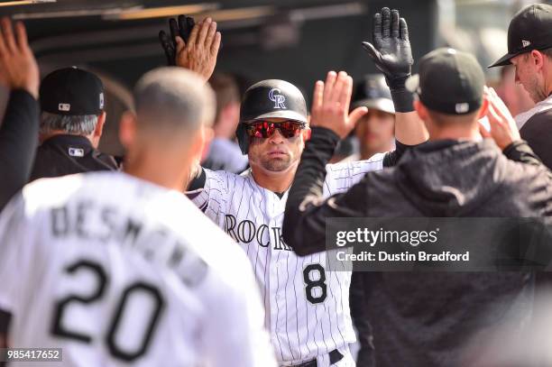 Gerardo Parra of the Colorado Rockies celebrates a run scored against the Miami Marlins at Coors Field on June 24, 2018 in Denver, Colorado.