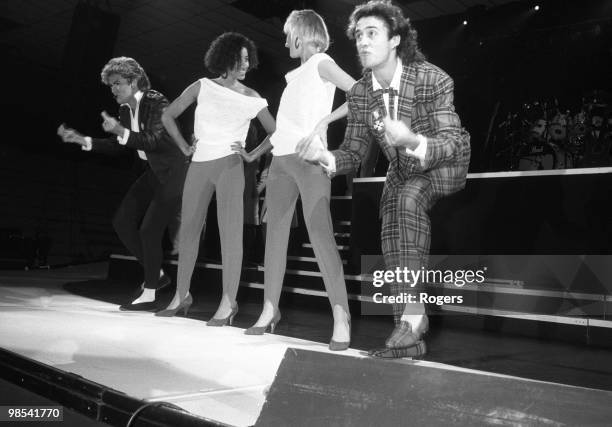 George Michael and Andrew Ridgeley of Wham! pictured with backing singers Pepsi & Shirlie performing in Newcastle, 6th December 1984.