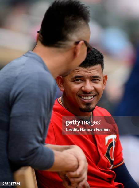 Eduardo Escobar of the Minnesota Twins speaks with trainer Masamichi Abe during the game against the Texas Rangers on June 24, 2018 at Target Field...