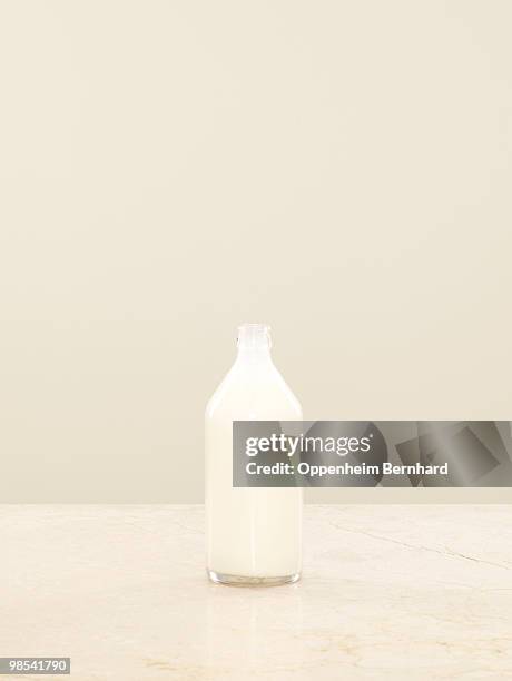 milk container sitting on surface - milk bottle photos et images de collection