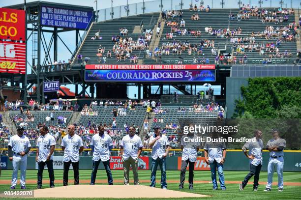 Current and former Colorado Rockies players Including Larry Walker, Todd Helton, Aaron Cook, Ellis Burks, and Jeff Francis participate in a pre-game...