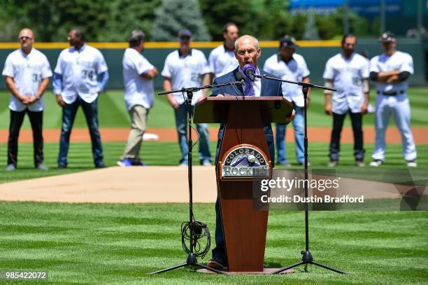 Commentator Drew Goodman speaks as current and former Colorado Rockies players Including Larry Walker, Todd Helton, Aaron Cook, Ellis Burks, and Jeff...