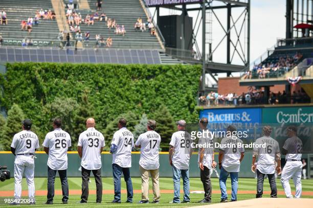 Current and former Colorado Rockies players Including Larry Walker, Todd Helton, Aaron Cook, Ellis Burks, and Jeff Francis participate in a pre-game...