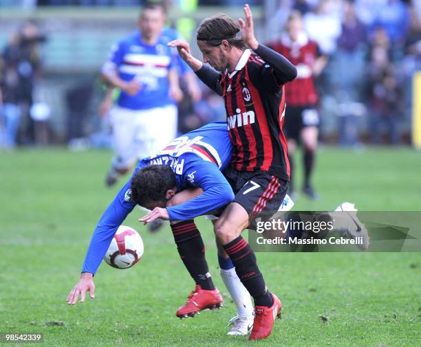 Giampaolo Pazzini of UC Sampdoria battles fot the ball against Luca Antonini of AC Milan during the Serie A match between UC Sampdoria and AC Milan...