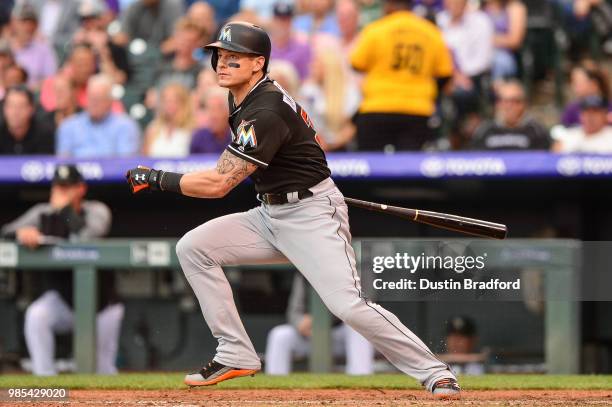 Derek Dietrich of the Miami Marlins hits a third inning solo homerun against the Colorado Rockies at Coors Field on June 22, 2018 in Denver, Colorado.