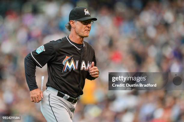 Manager Don Mattingly of the Miami Marlins jogs to the dugout during a game against the Colorado Rockies at Coors Field on June 22, 2018 in Denver,...