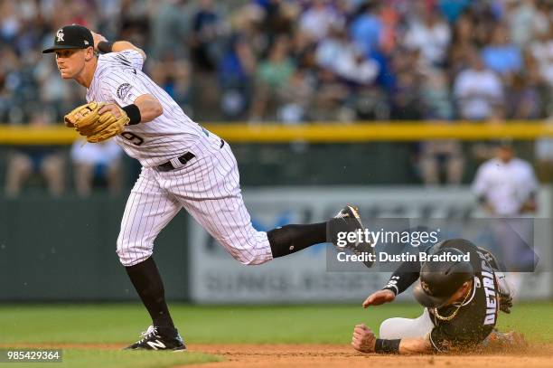 LeMahieu of the Colorado Rockies forces out Derek Dietrich of the Miami Marlins during a game at Coors Field on June 22, 2018 in Denver, Colorado.