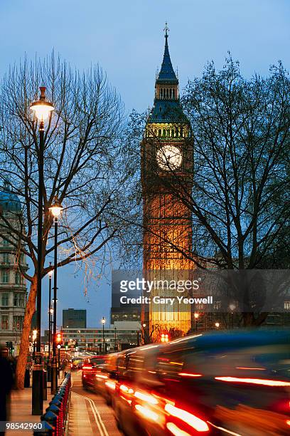 busy street by big ben - newpremiumuk stock pictures, royalty-free photos & images