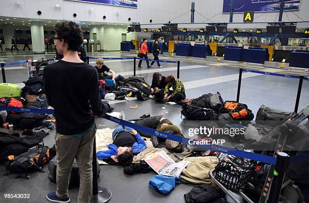 European passengers sleep on the floor of Beijing Capital International airport after flights from China to Europe were cancelled on April 19, 2010....