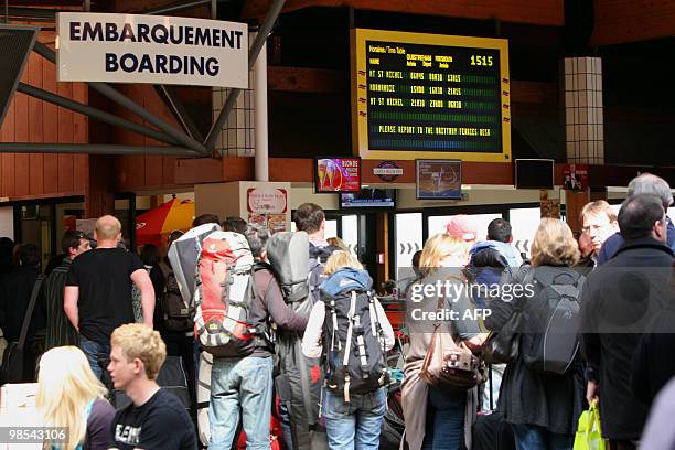 People wait to board a ferry bound for England on April 19, 2010 at the Ouistreham harbor, northwestern France. Flights over Europe have been banned...