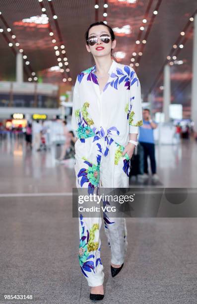 Actress Qin Hailu arrives at Beijing Capital International Airport on June 26, 2018 in Beijing, China.