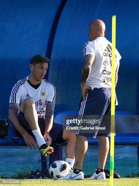 Jorge Sampaoli coach of Argentina talk with Lucas Biglia of Argentina prior a training session at Stadium of Syroyezhkin sports school on June 27,...