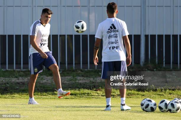 Marcos Acuna of Argentina and Paulo Dybala of Argentina warm up during a training session at Stadium of Syroyezhkin sports school on June 27, 2018 in...