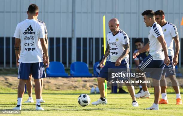 Jorge Sampaoli coach of Argentina and players of Argentina warm up during a training session at Stadium of Syroyezhkin sports school on June 27, 2018...