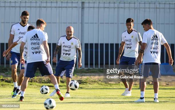 Jorge Sampaoli coach of Argentina and players of Argentina warm up during a training session at Stadium of Syroyezhkin sports school on June 27, 2018...