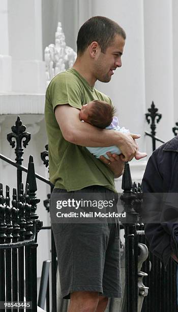 Joe Cole holds his baby daughter Ruby Tatiana on April 19, 2010 in London, England.