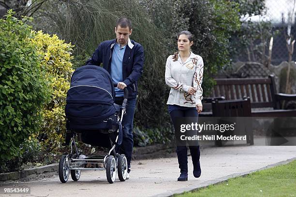Joe Cole and Carly Cole take a stroll with their baby daughter Ruby Tatiana on April 19, 2010 in London, England.