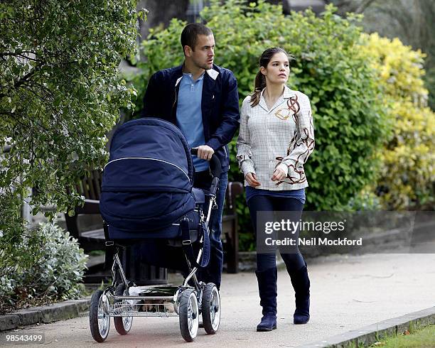 Joe Cole and Carly Cole take a stroll with their baby daughter Ruby Tatiana on April 19, 2010 in London, England.