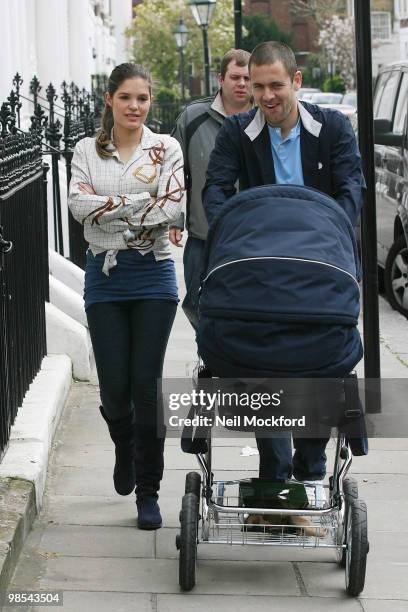 Joe Cole and Carly Cole take a stroll with their baby daughter Ruby Tatiana on April 19, 2010 in London, England.