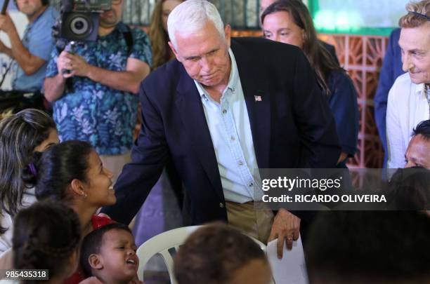 Vice President Mike Pence visits Venezuelan refugees at the Santa Catarina Humanitarian Centre in Manaus, northern Brazil, on June 27, 2018. - US...