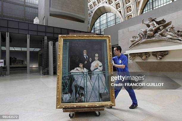 Staff member of the Orsay museum prepares to pack "Le Balcon" by French artist Edouard Manet on April 19, 2010 in Paris. The painting will be shown...