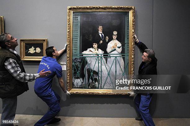 Staff members of the Orsay museum prepare to pack "Le Balcon" by French artist Edouard Manet on April 19, 2010 in Paris. The painting will be shown...