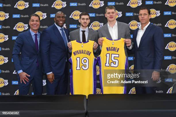 Magic Johnson, Rob Pelinka and Luke Walton of the Los Angeles Lakers pose for a photo with 2018 NBA draft picks Moritz Wagner and Sviatoslav...