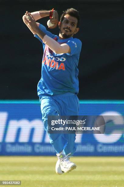 India's Yuzvendra Chahal bowls during the Twenty20 International cricket match between Ireland and India at Malahide cricket club, in Dublin on June...