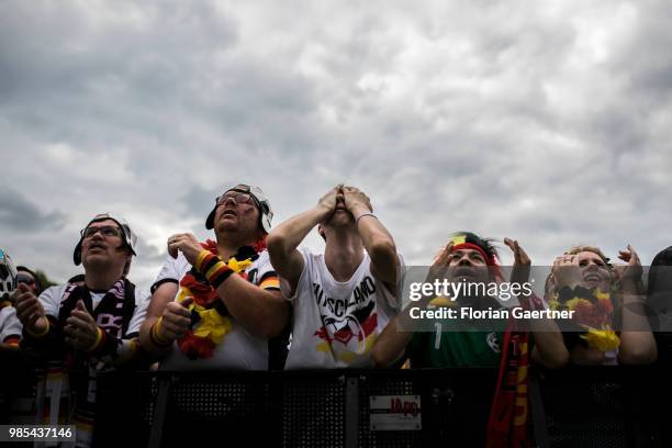 Fans react during the public viewing in front of the Brandenburg Gate of the game Germany versus South Korea at the FIFA Soccer World Championship on...